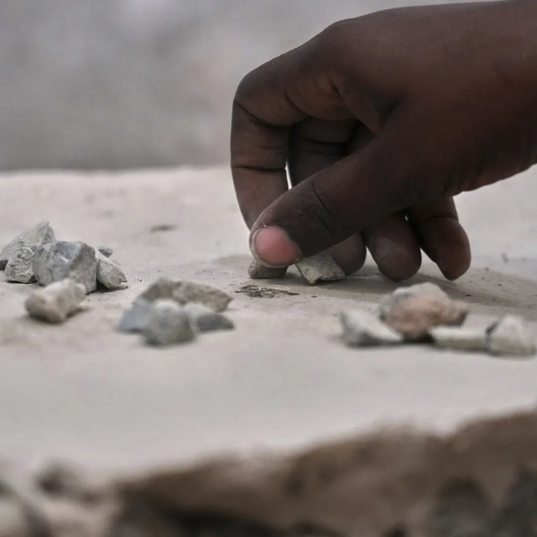 Pebbles in hand for the Jamarat stoning ritual during Hajj
